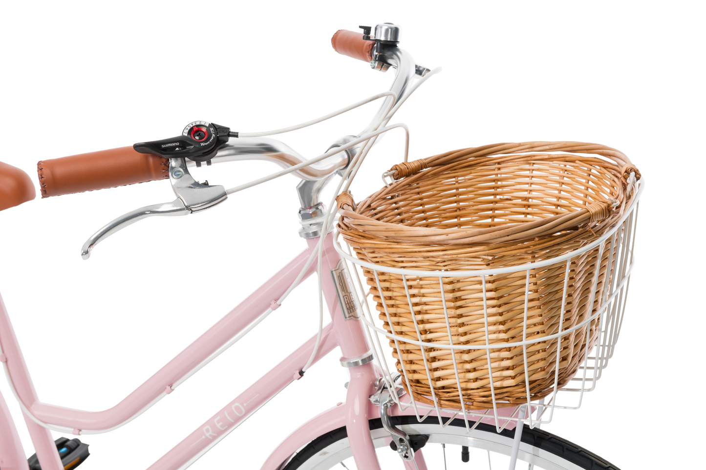 Ladies Classic Plus Vintage Bike in Soft Pink showing handlebars and front wicker basket from Reid Cycles