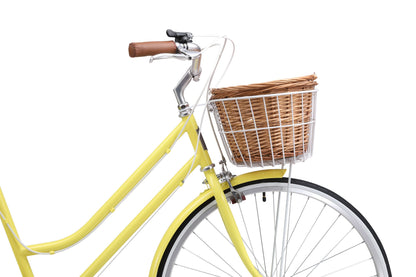 Ladies Classic Plus Vintage Bike in Lemon on front angle featuring front wicker basket from Reid Cycles Australia