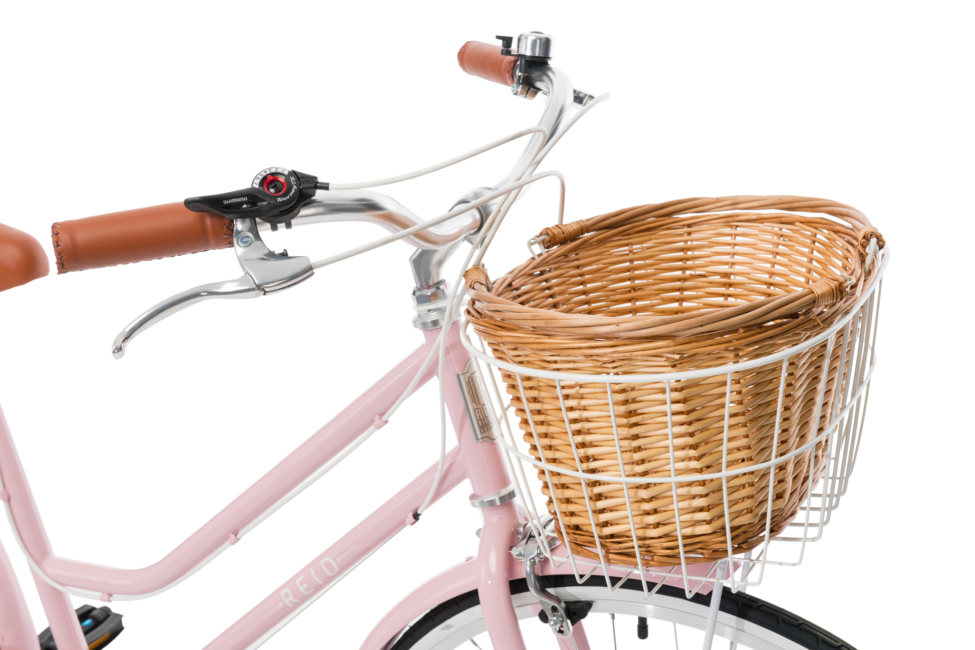 Ladies Classic Plus Vintage Bike in Soft Pink showing handlebars and front wicker basket from Reid Cycles