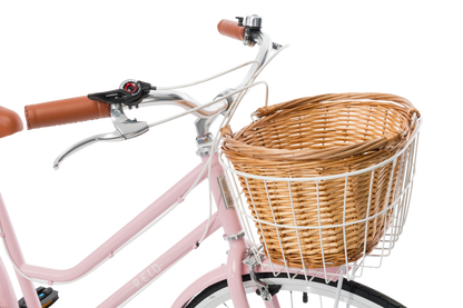 Ladies Classic Plus Vintage Bike in Soft Pink showing handlebars and front wicker basket from Reid Cycles